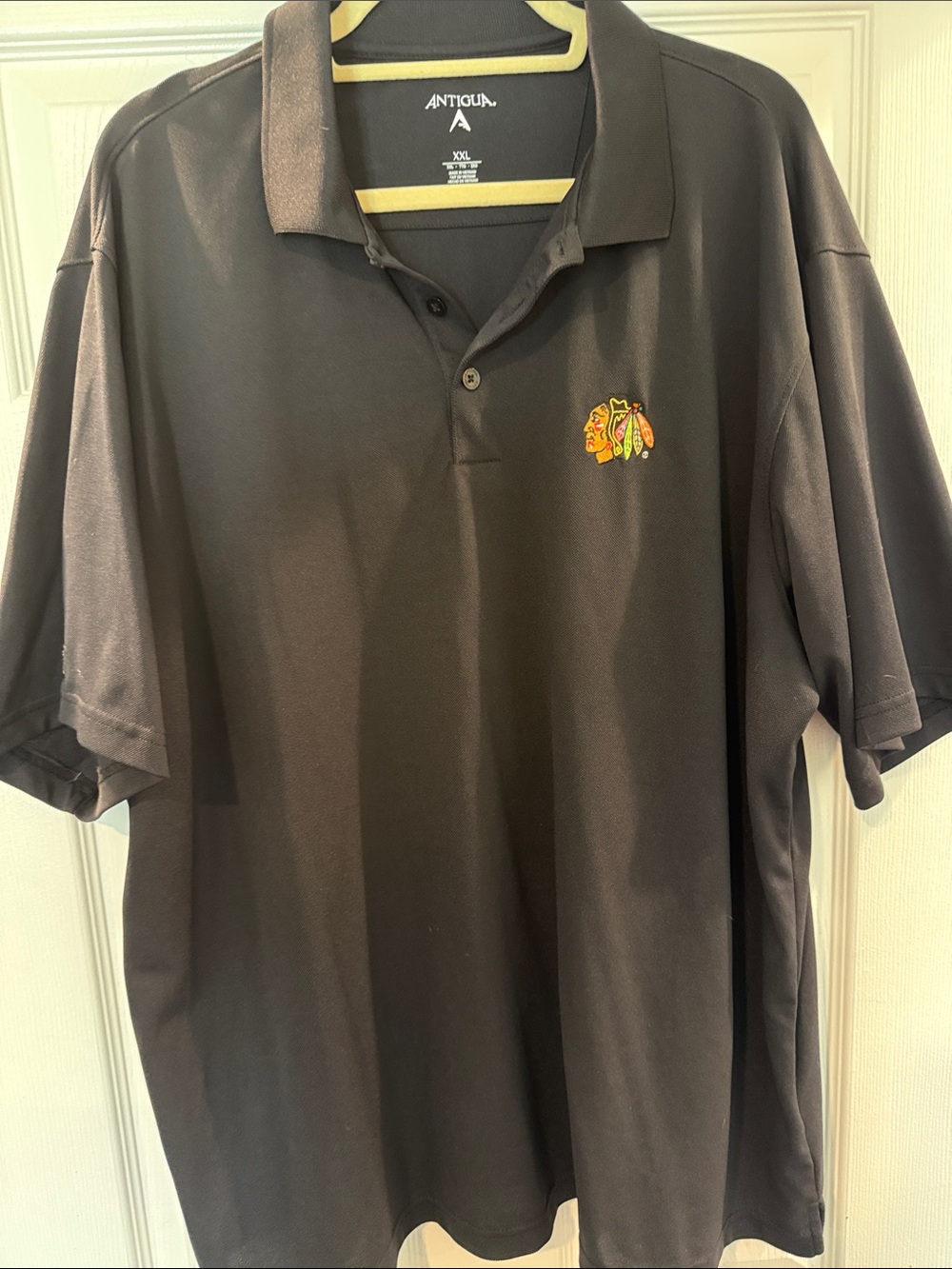 Antigua Black Men’s Polo with Blackhawks Team Crest